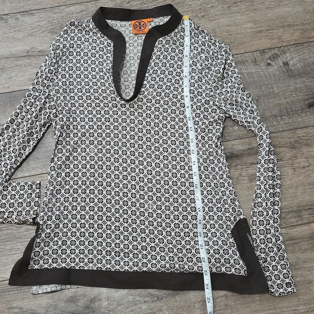Tory Burch printed tunic top featuring a split neckline and long sleeves